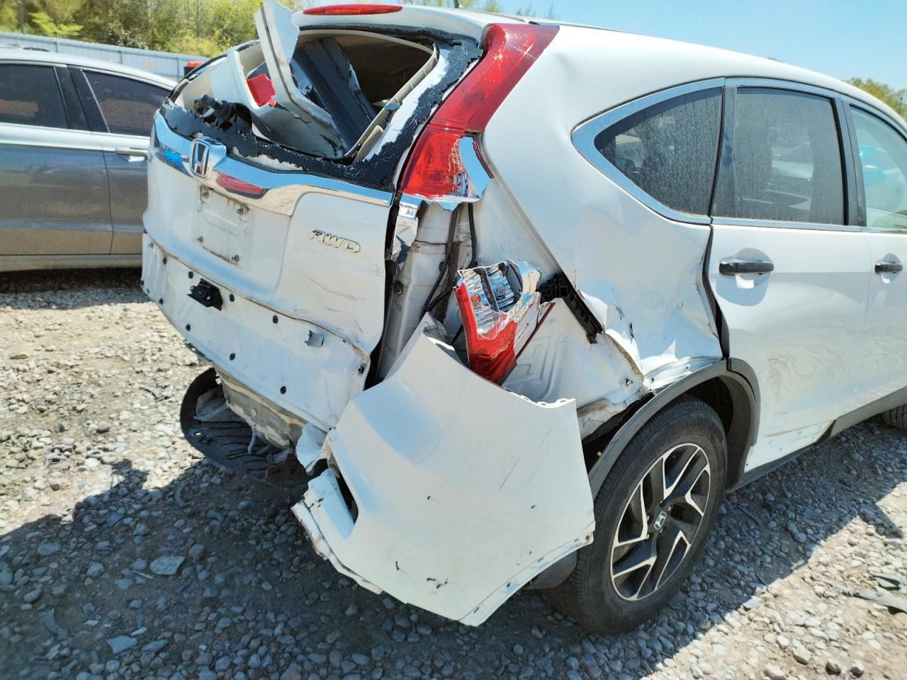 Photo 9 from auction – 2016 HONDA CR-V with VIN 5J6RM4H40GL116179