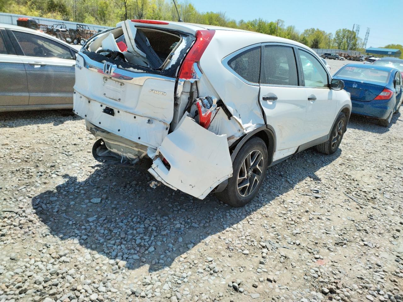 Photo 4 from auction – 2016 HONDA CR-V with VIN 5J6RM4H40GL116179