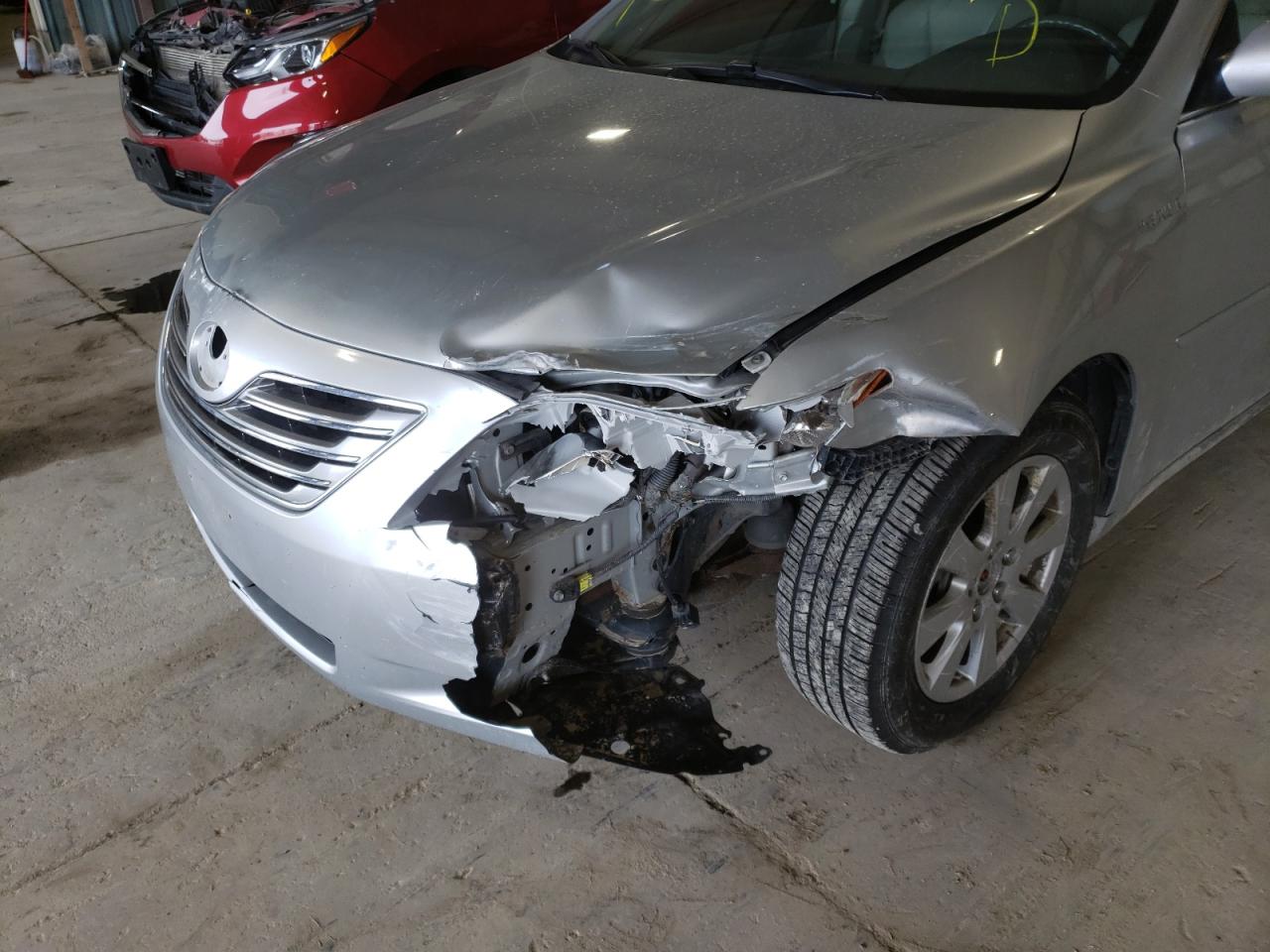 Photo 9 from auction – 2007 TOYOTA CAMRY HYBR with VIN JTNBB46K073025861