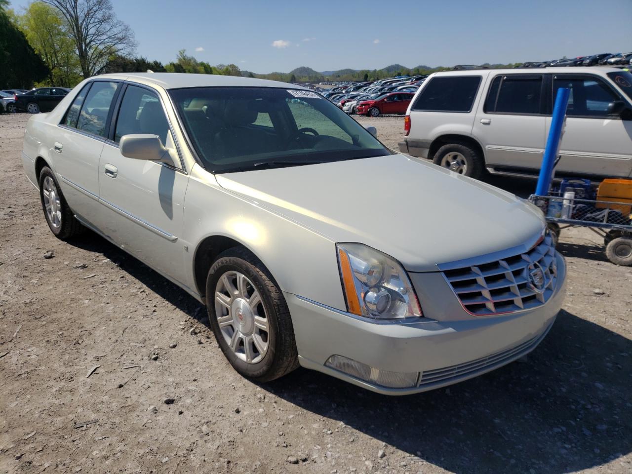 CADILLAC DTS 2010 with VIN 1G6KA5EY6AU109979 - Photo from auction