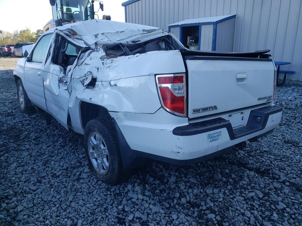 Photo 3 from auction – 2010 HONDA RIDGELINE with VIN 5FPYK1F45AB002401