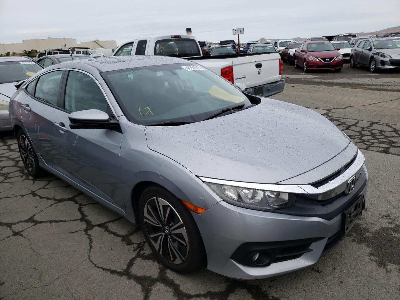HONDA CIVIC EX 2017 with VIN 2HGFC1F30HH639920 - Photo from auction