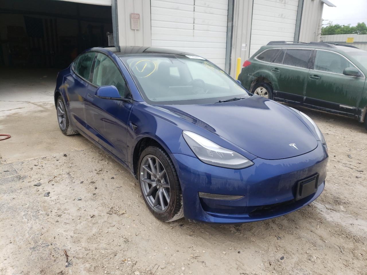 TESLA MODEL 3 2021 with VIN 5YJ3E1EA1MF087176 - Photo from auction