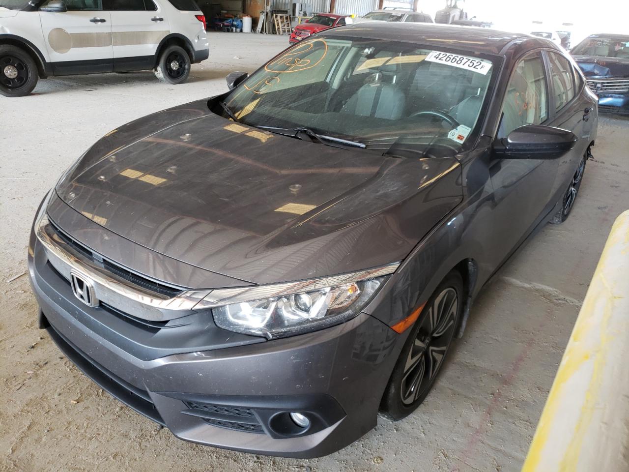 Photo 2 from auction – 2018 HONDA CIVIC EX with VIN JHMFC1F37JX033478