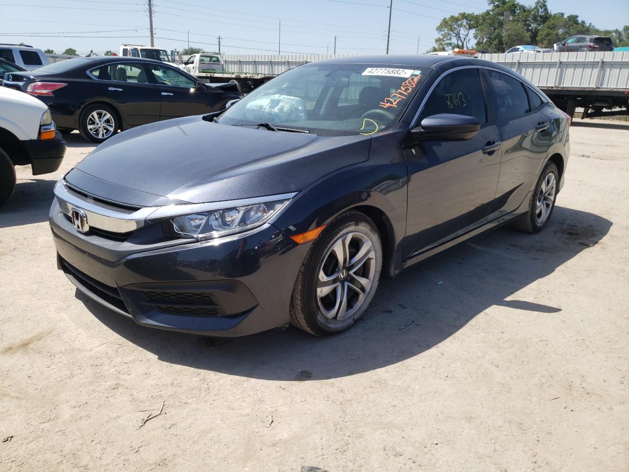 Photo 2 from auction – 2018 HONDA CIVIC LX with VIN 19XFC2F55JE026683