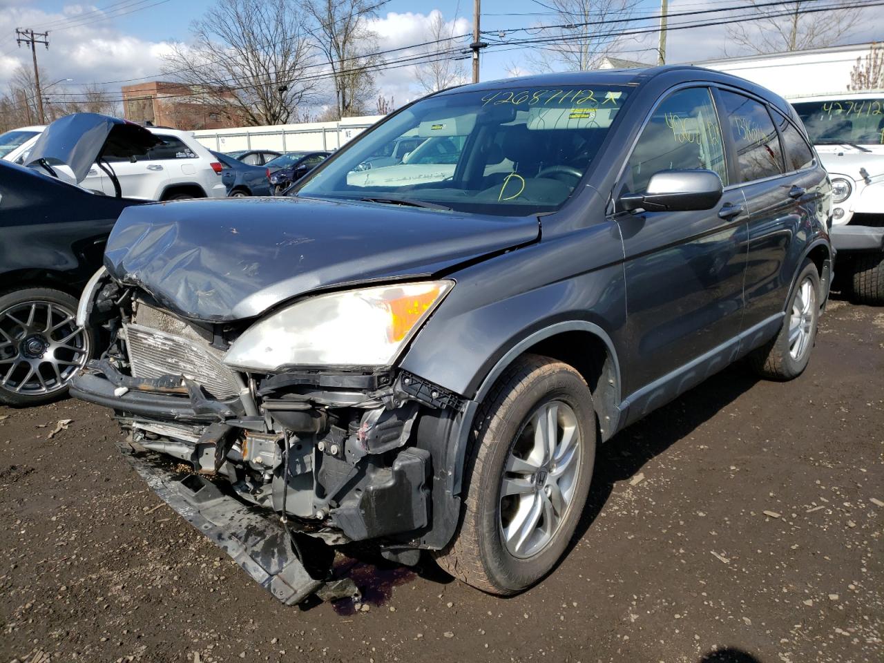Photo 2 from auction – 2011 HONDA CR-V EXL with VIN JHLRE4H7XBC010850