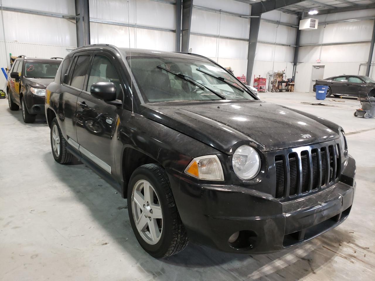 JEEP COMPASS SP 2010 with VIN 1J4NT1FA6AD640964 - Photo from auction