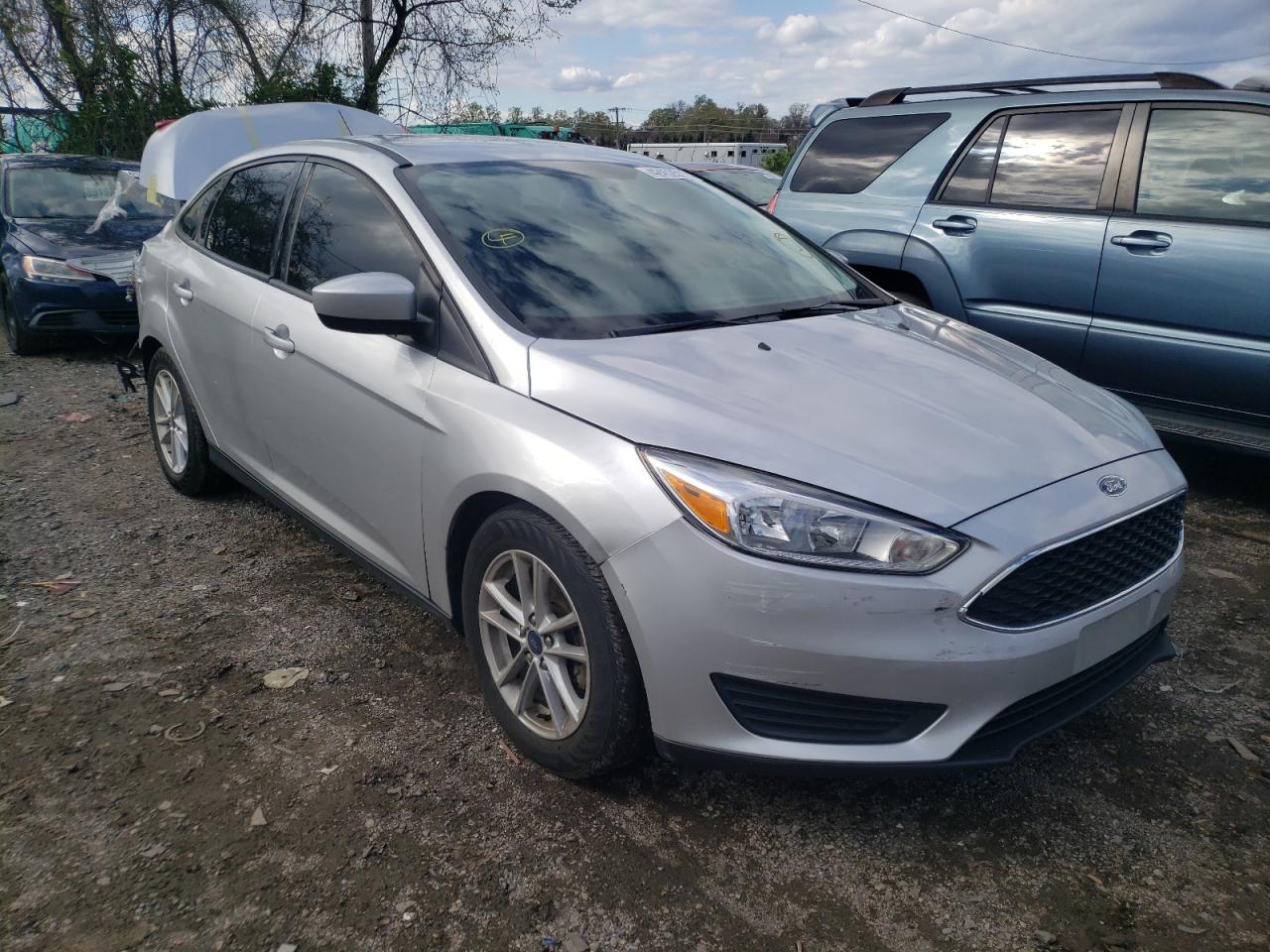 FORD FOCUS SE 2018 with VIN 1FADP3F29JL326859 - Photo from auction