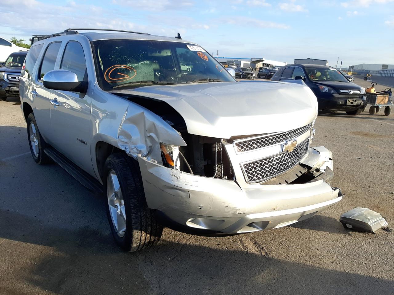 CHEVROLET TAHOE C150 2011 with VIN 1GNSCBE03BR136388 - Photo from auction