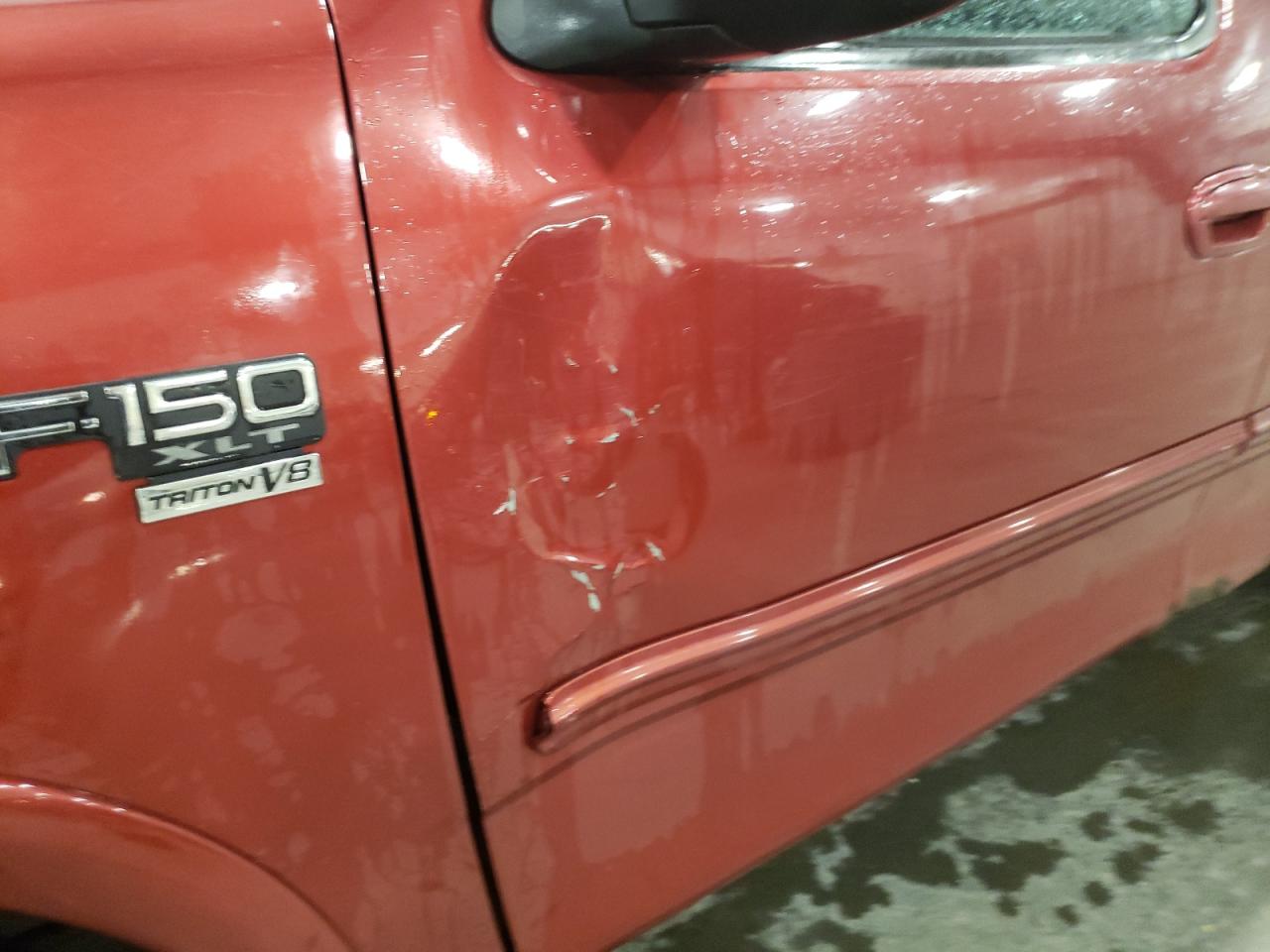 Photo 9 from auction – 2002 FORD F150 with VIN 1FTRX18W22NA77332