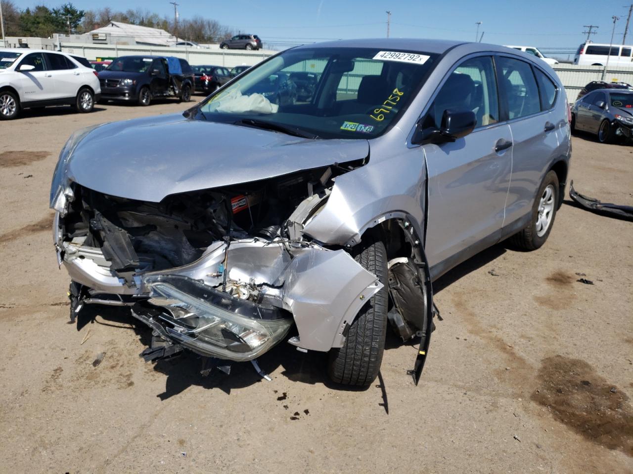 Photo 2 from auction – 2015 HONDA CR-V LX with VIN 2HKRM4H38FH691758