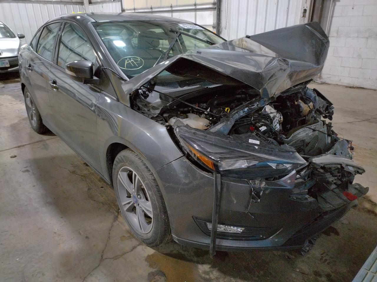 FORD FOCUS SE 2018 with VIN 1FADP3FE8JL304670 - Photo from auction