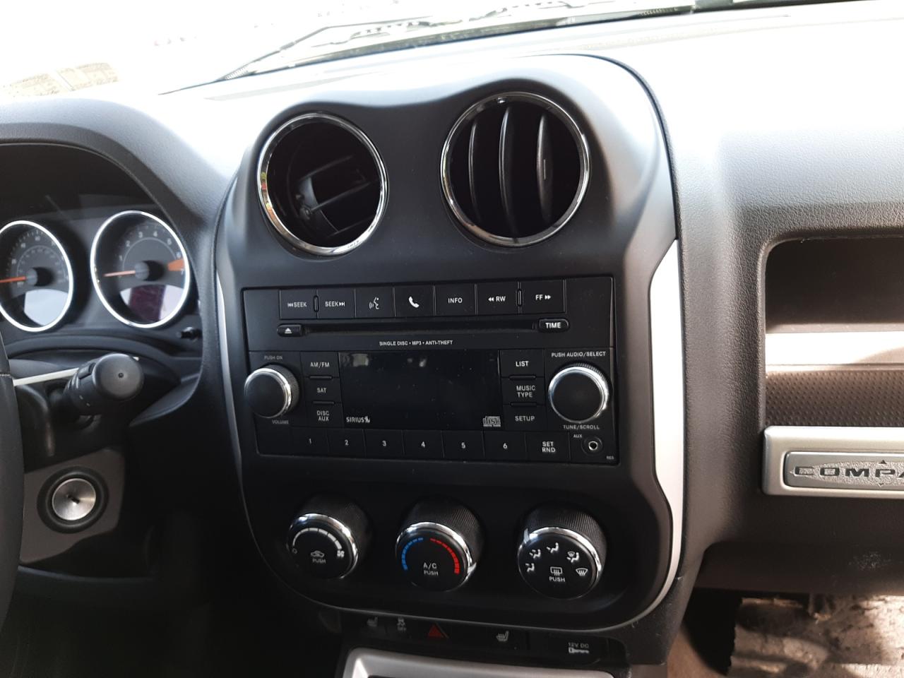 Photo 9 from auction – 2014 JEEP COMPASS LA with VIN 1C4NJDEB8ED816295