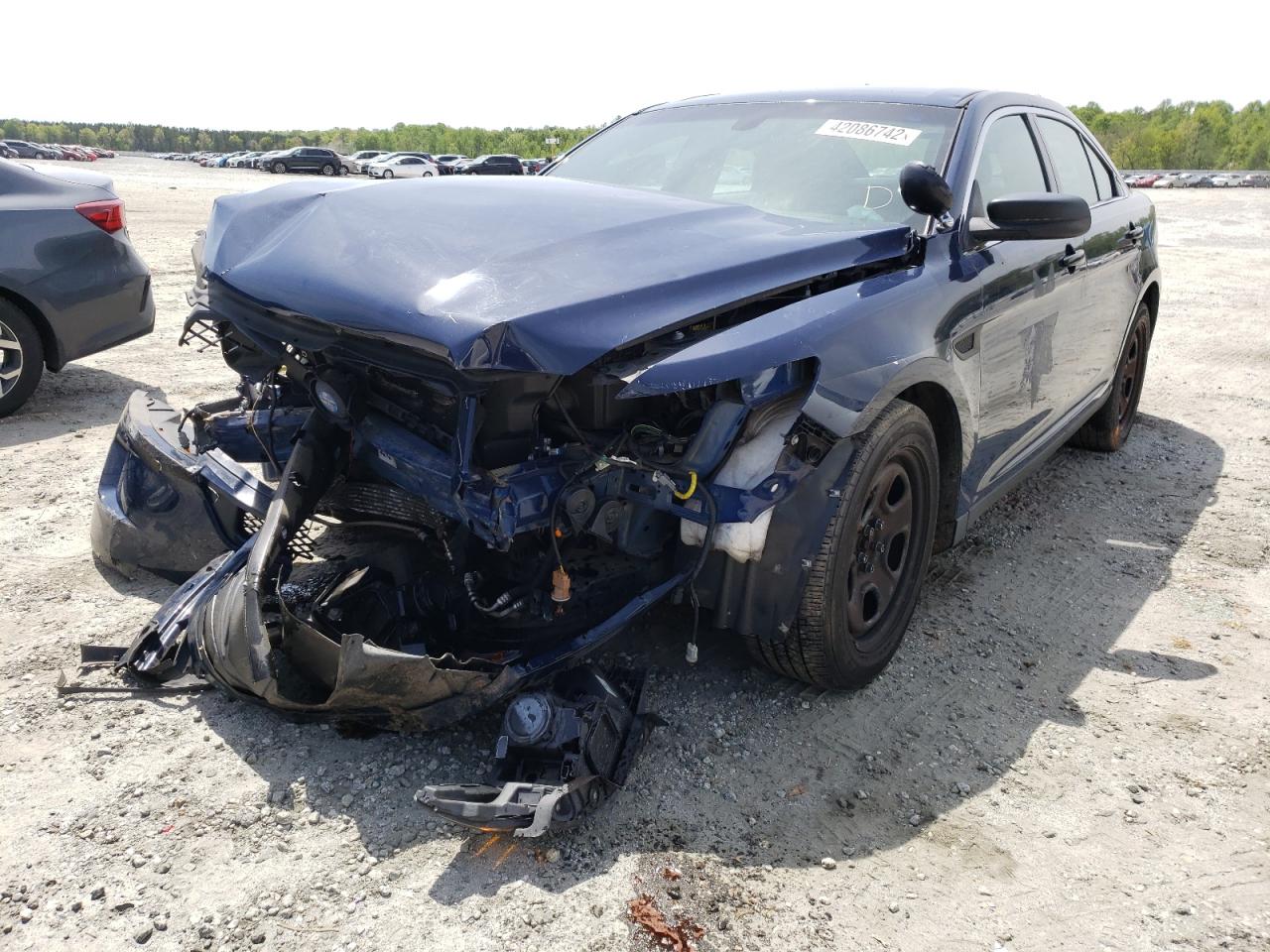 Photo 2 from auction – 2015 FORD TAURUS POL with VIN 1FAHP2L8XFG126092