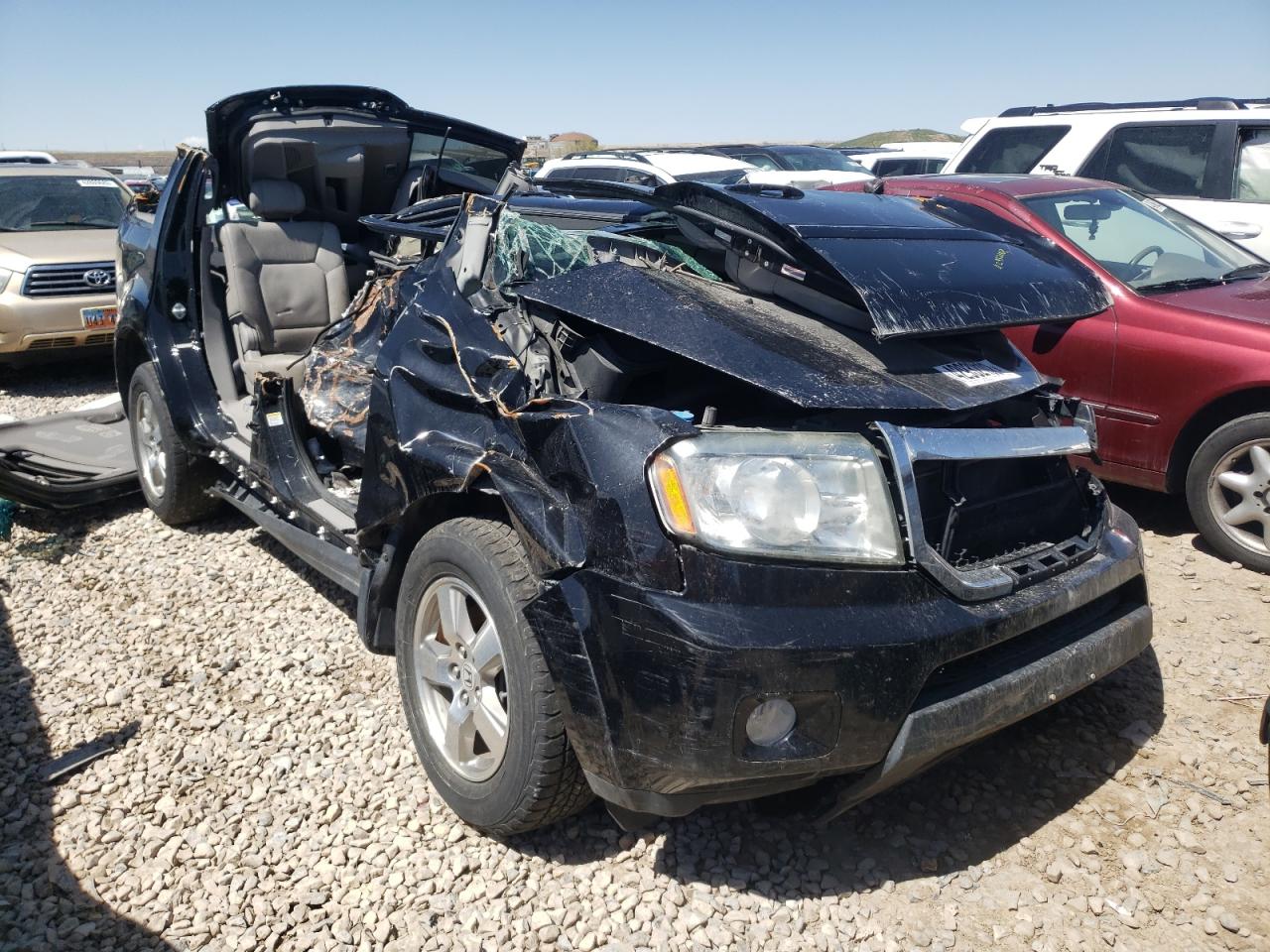 HONDA PILOT EXL 2011 with VIN 5FNYF4H57BB039858 - Photo from auction