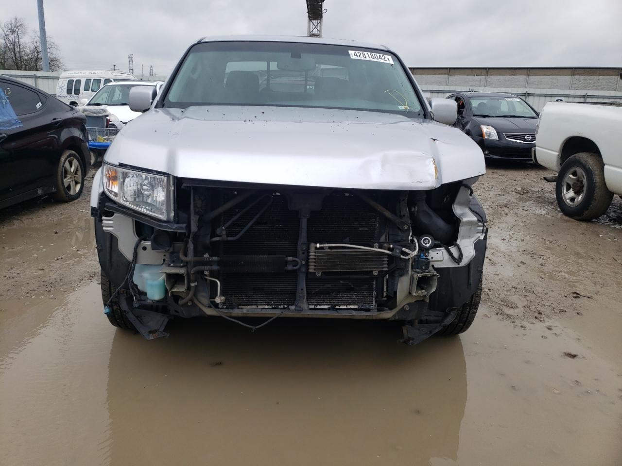Photo 9 from auction – 2011 HONDA RIDGELINE with VIN 5FPYK1F54BB004747