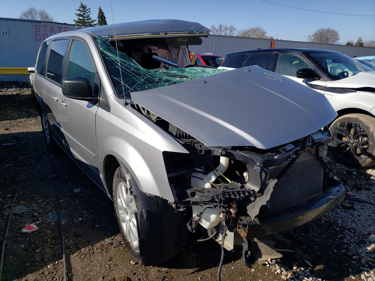 DODGE GRAND CARA 2015 with VIN 2C4RDGBG0FR518011 - Photo from auction