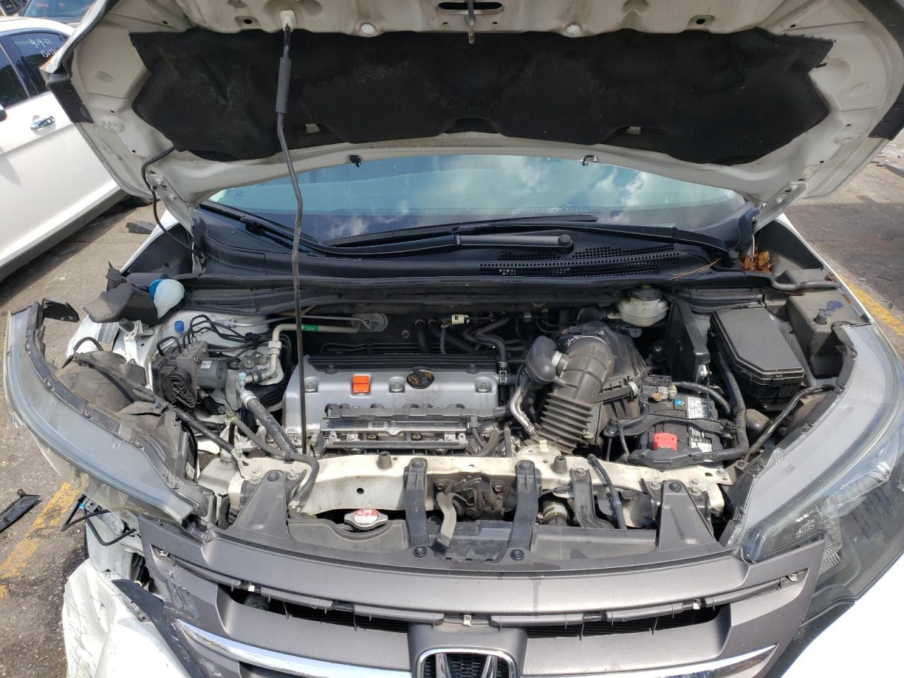 Photo 7 from auction – 2014 HONDA CR-V LX with VIN 5J6RM3H31EL034704