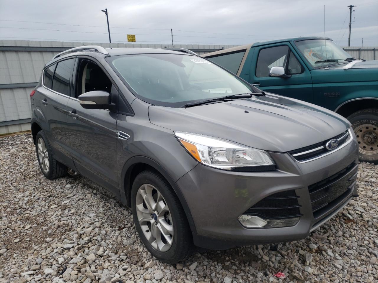 FORD ESCAPE TIT 2014 with VIN 1FMCU0J92EUE36908 - Photo from auction