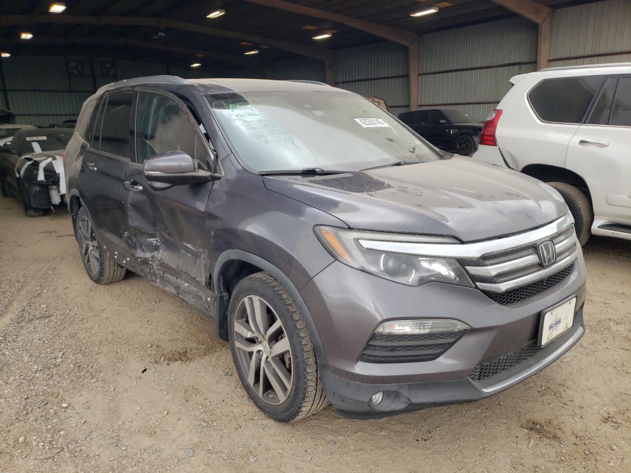 Photo 1 from auction – 2017 HONDA PILOT TOUR with VIN 5FNYF5H91HB005545