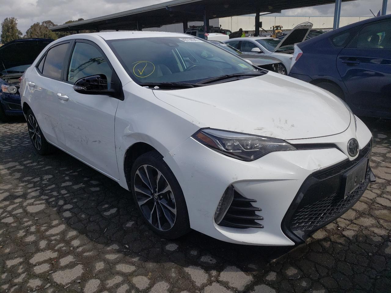 TOYOTA COROLLA L 2019 with VIN 5YFBURHE3KP934857 - Photo from auction