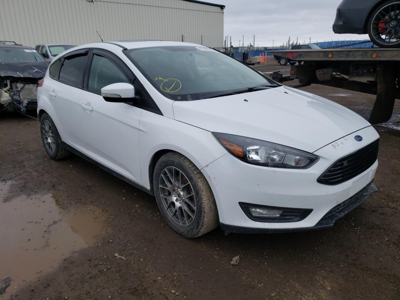 FORD FOCUS SE 2016 with VIN 1FADP3KE0GL287099 - Photo from auction