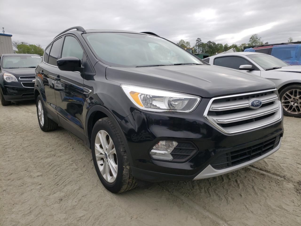 FORD ESCAPE SE 2018 with VIN 1FMCU0GDXJUA52106 - Photo from auction