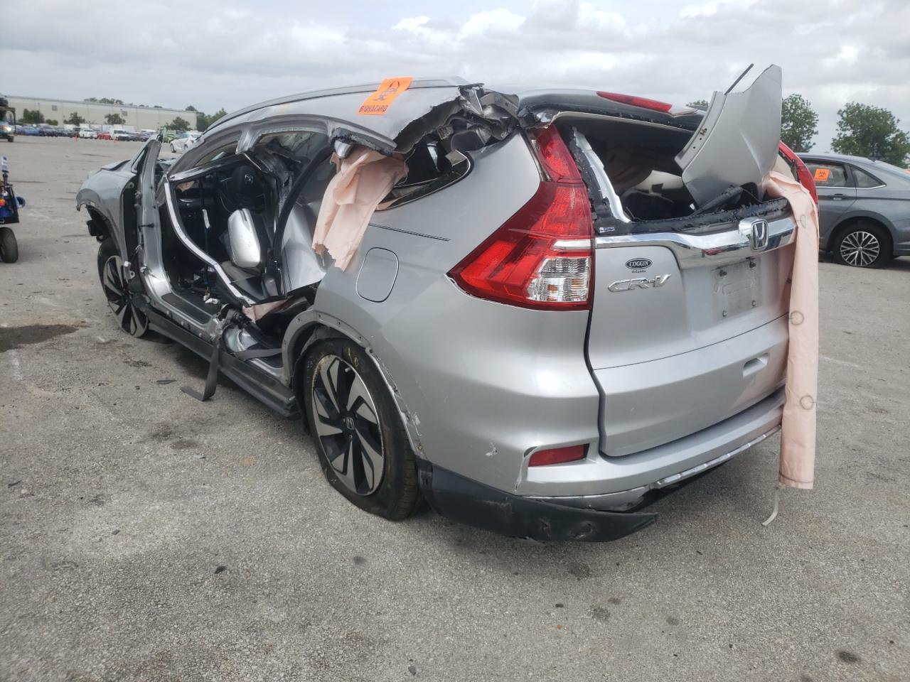 Photo 3 from auction – 2015 HONDA CR-V TOURI with VIN 5J6RM3H95FL019872