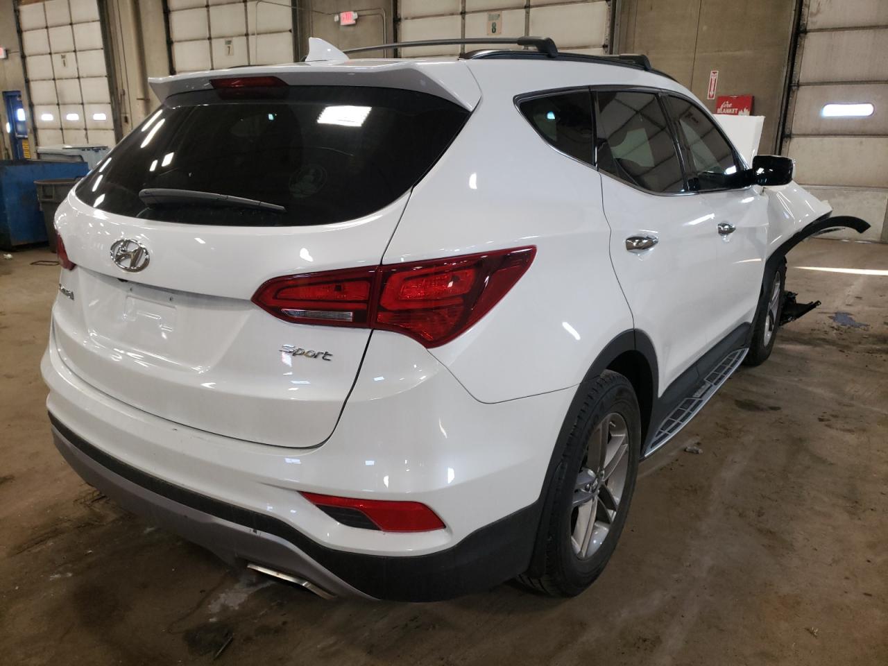Photo 4 from auction – 2017 HYUNDAI SANTA FE S with VIN 5NMZU3LB9HH023895