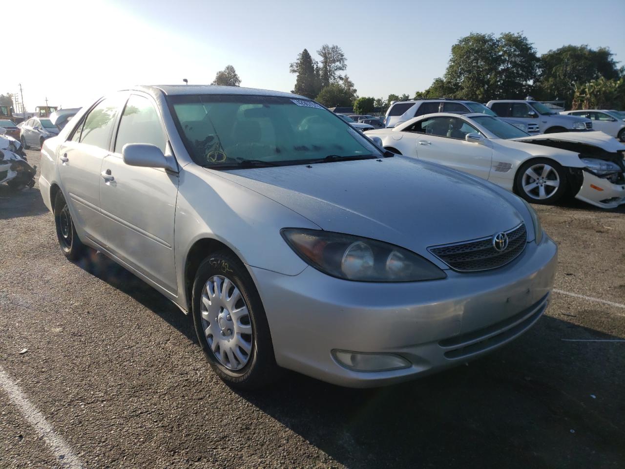 TOYOTA CAMRY LE 2002 with VIN JTDBE32K720043621 - Photo from auction