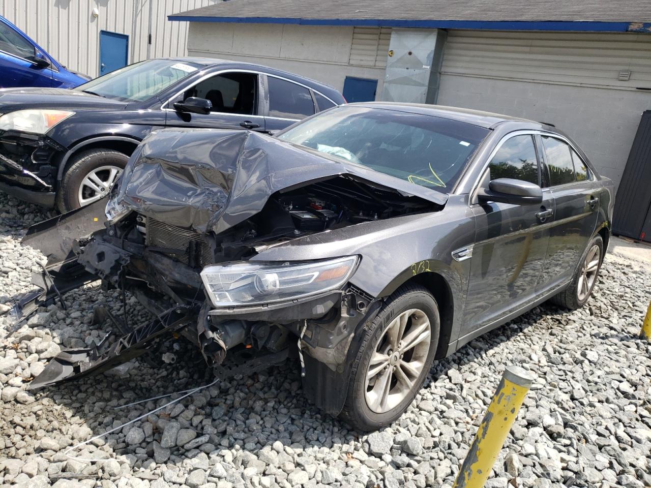 Photo 2 from auction – 2015 FORD TAURUS SEL with VIN 1FAHP2E83FG166849