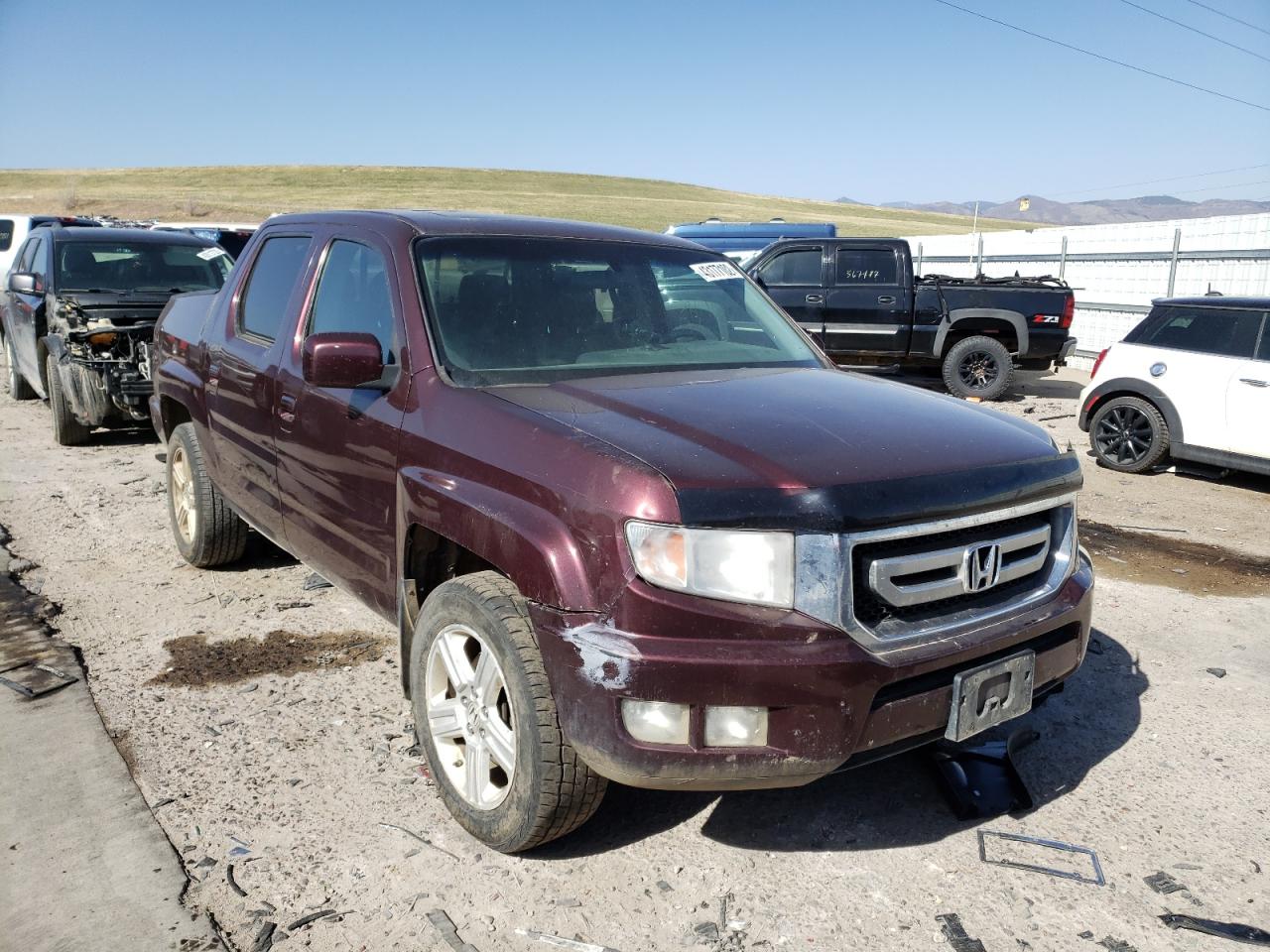 HONDA RIDGELINE 2011 with VIN 5FPYK1F56BB006970 - Photo from auction