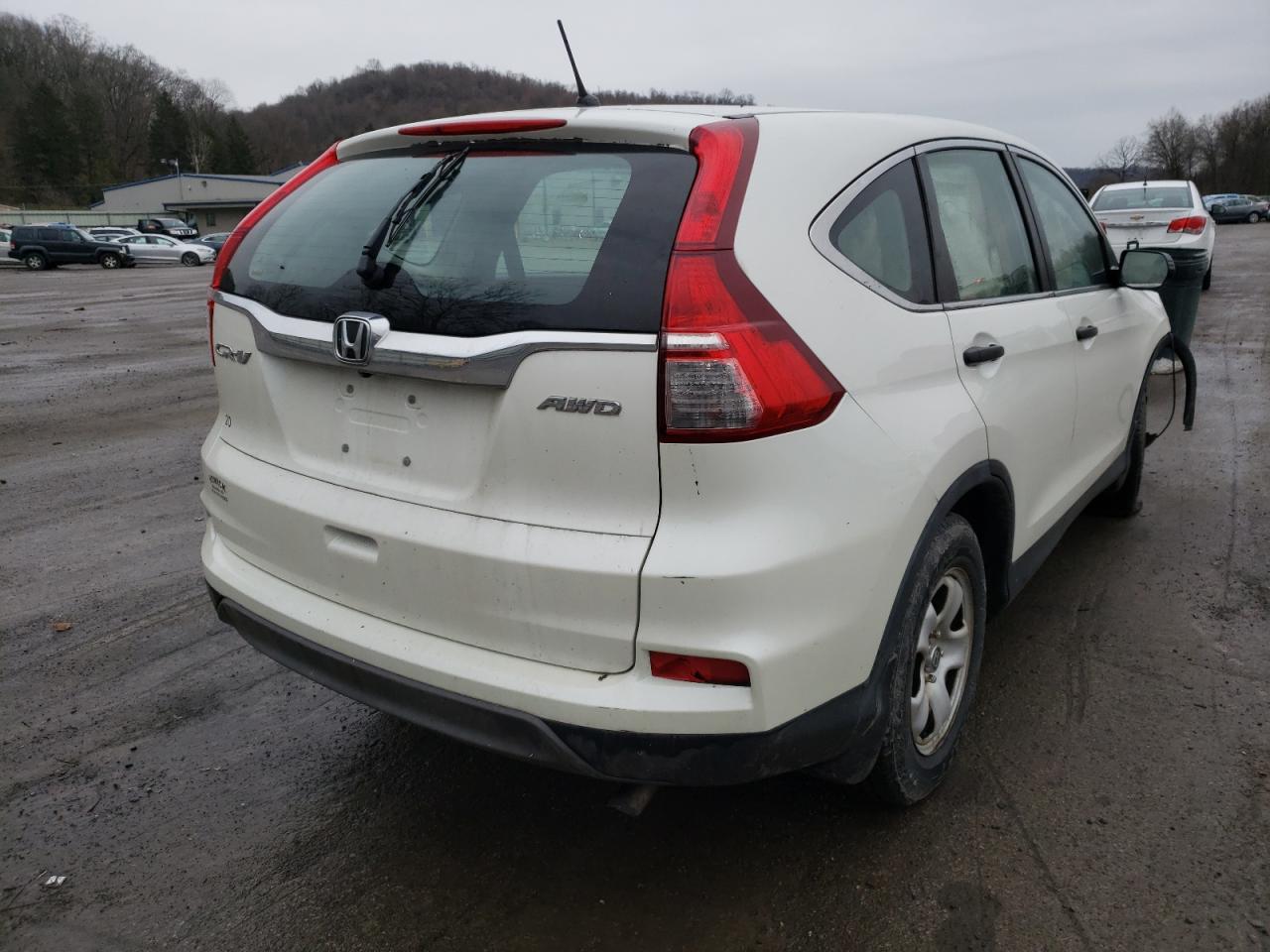 Photo 4 from auction – 2015 HONDA CR-V LX with VIN 5J6RM4H35FL045891