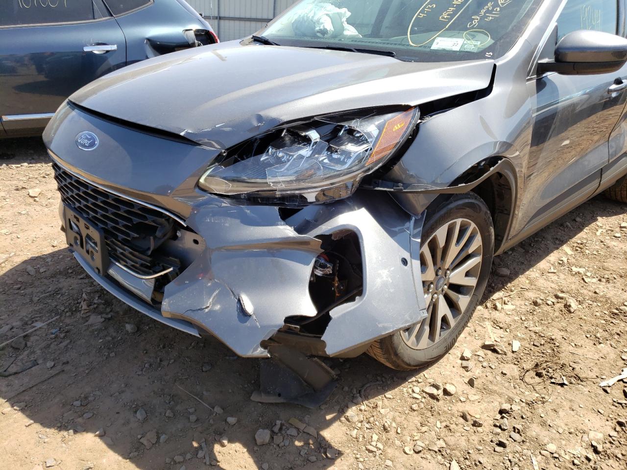Photo 9 from auction – 2021 FORD ESCAPE TIT with VIN 1FMCU9J91MUA58082