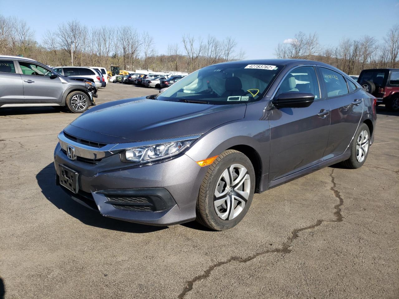 Photo 2 from auction – 2018 HONDA CIVIC LX with VIN 2HGFC2F58JH595968