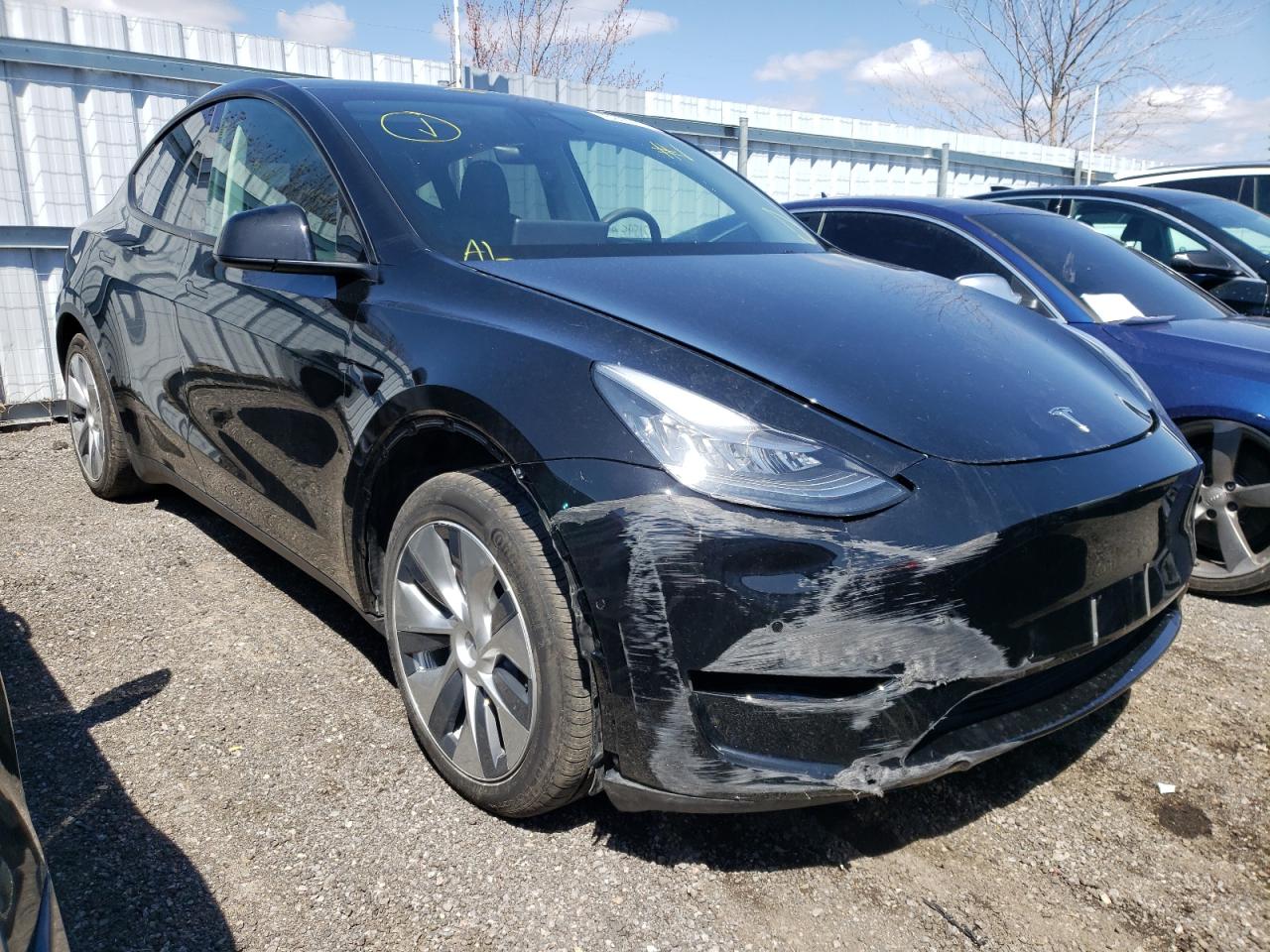 TESLA MODEL Y 2021 with VIN 5YJYGAEE8MF112612 - Photo from auction