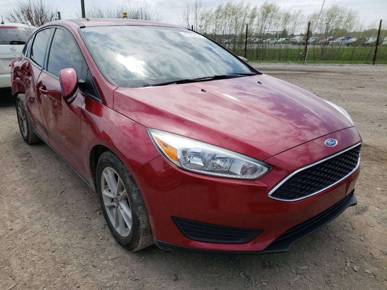 FORD FOCUS SE 2017 with VIN 1FADP3FE0HL309856 - Photo from auction