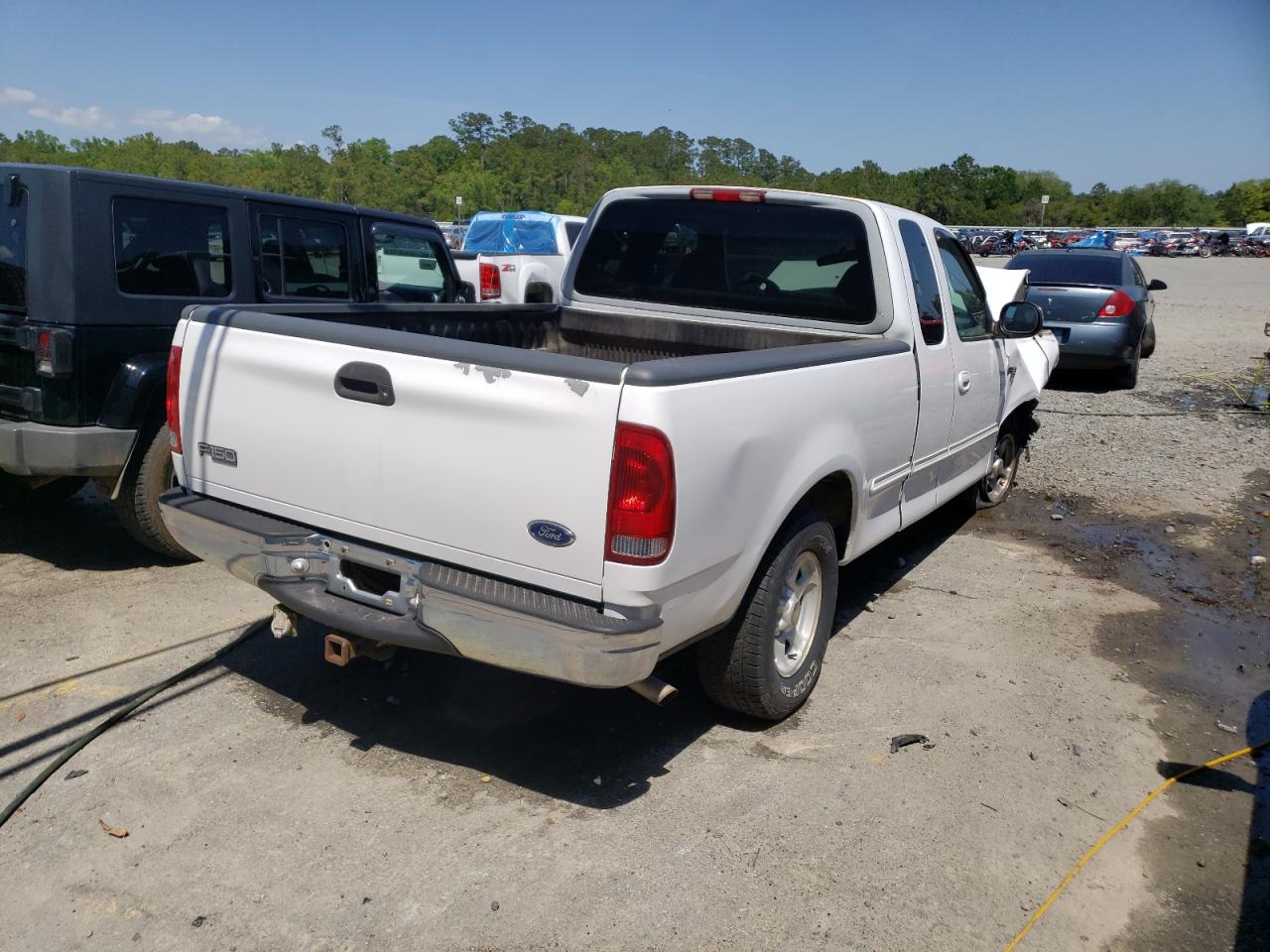 Photo 4 from auction – 1998 FORD F150 with VIN 1FTRX17L5WNA85356