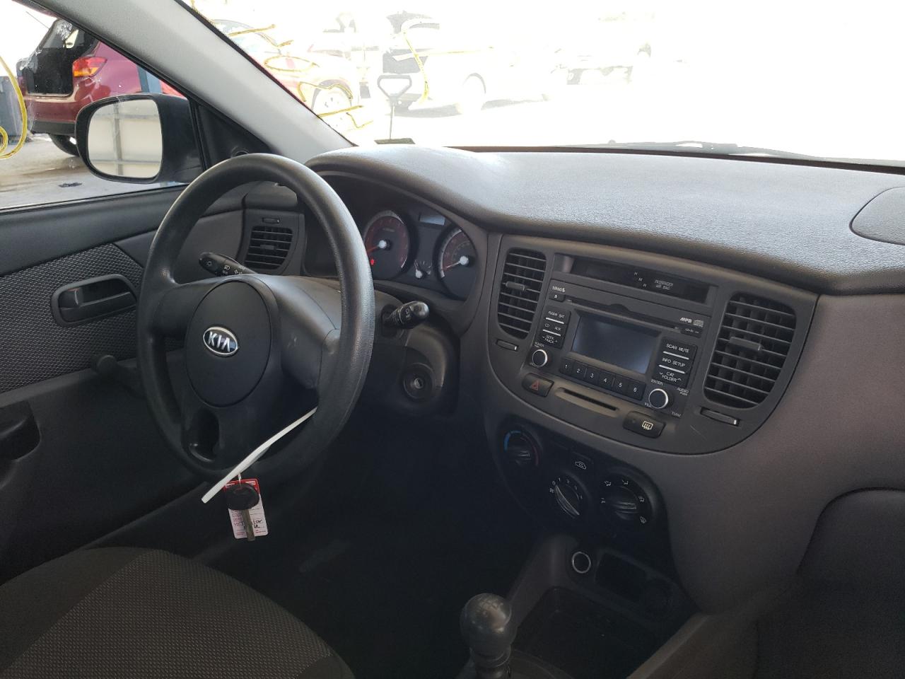 Photo 9 from auction – 2011 KIA RIO BASE with VIN KNADH4A30B6955257