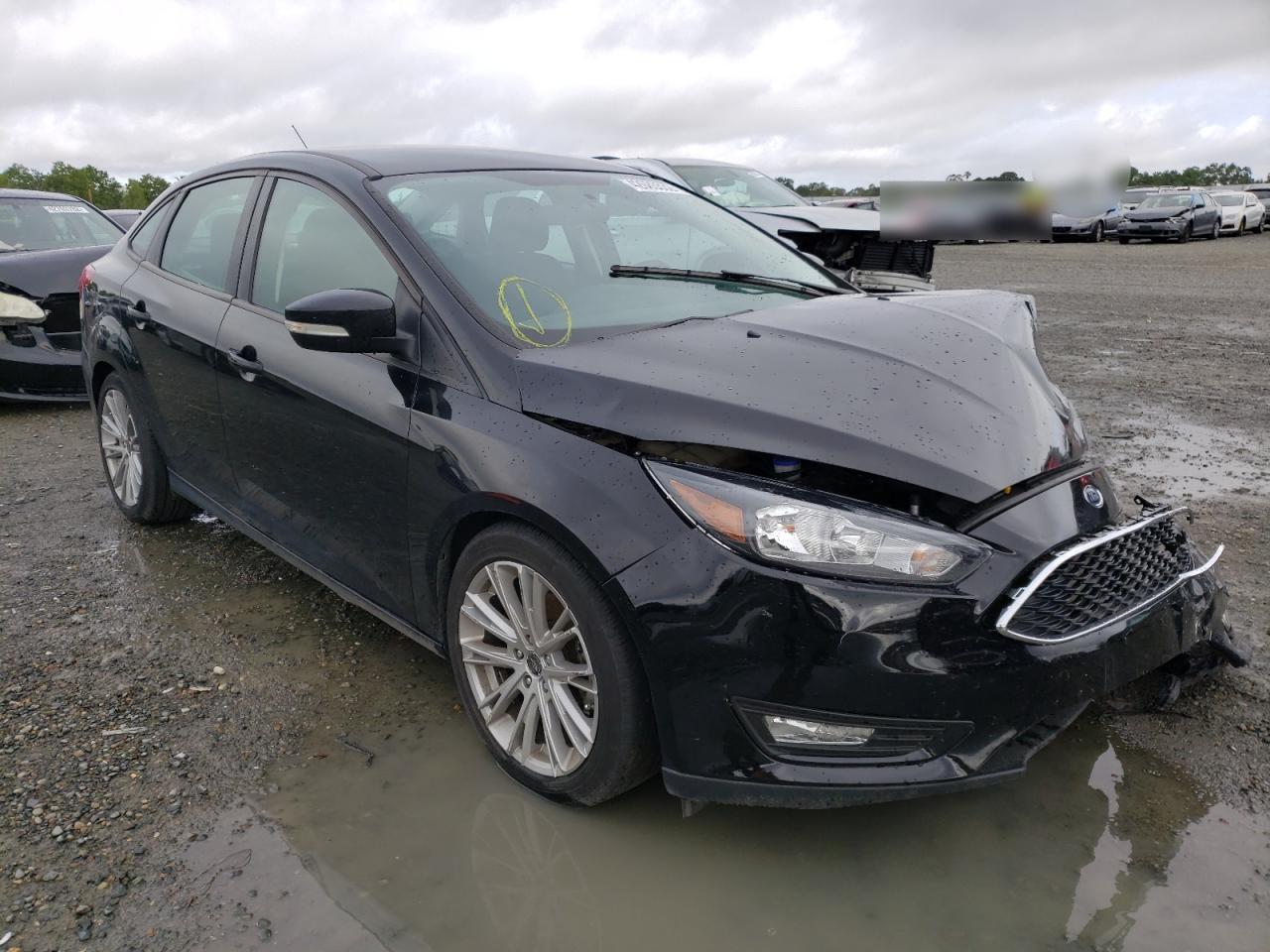 FORD FOCUS SE 2017 with VIN 1FADP3FE9HL296296 - Photo from auction