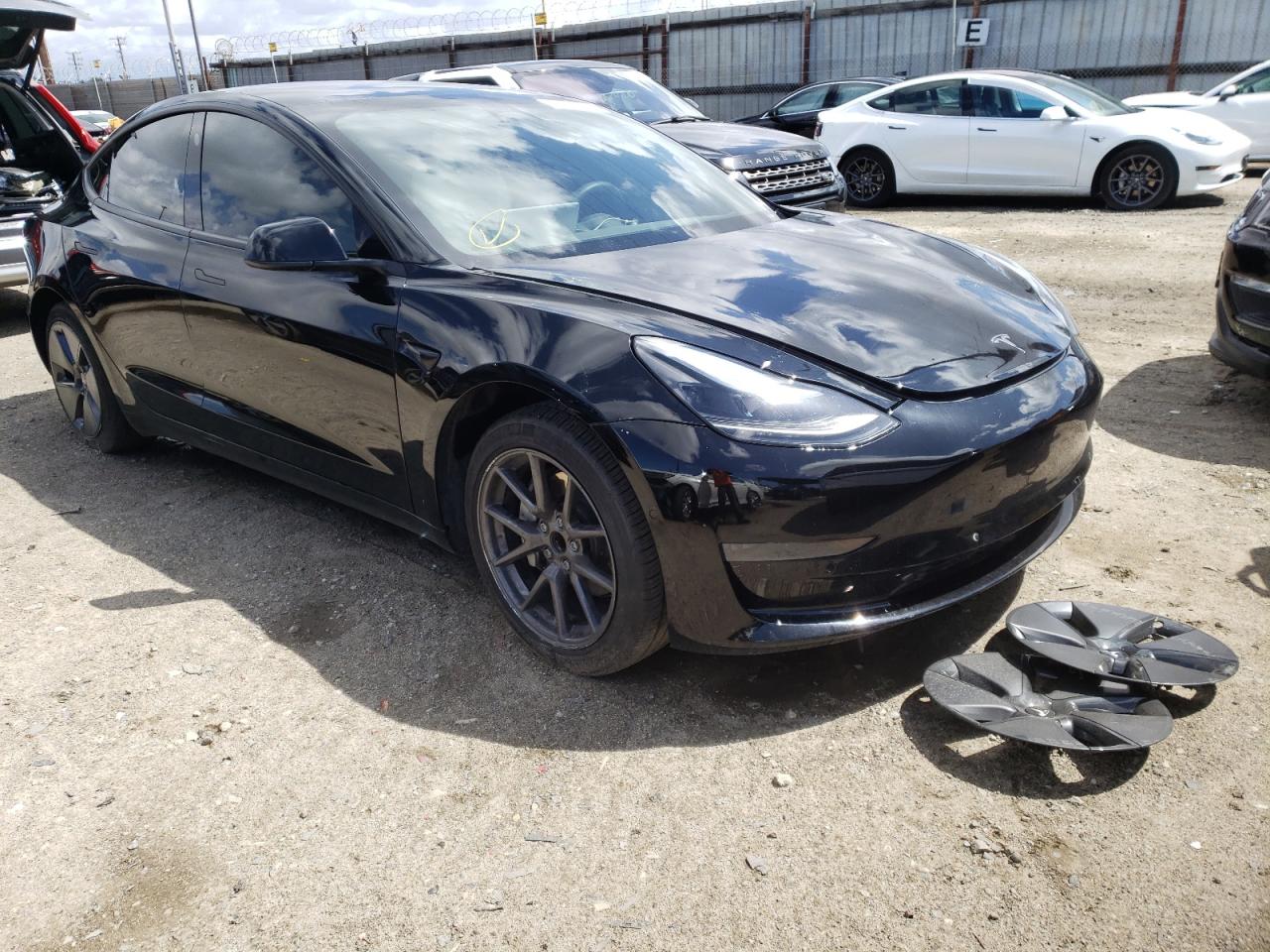 TESLA MODEL 3 2021 with VIN 5YJ3E1EA7MF877145 - Photo from auction