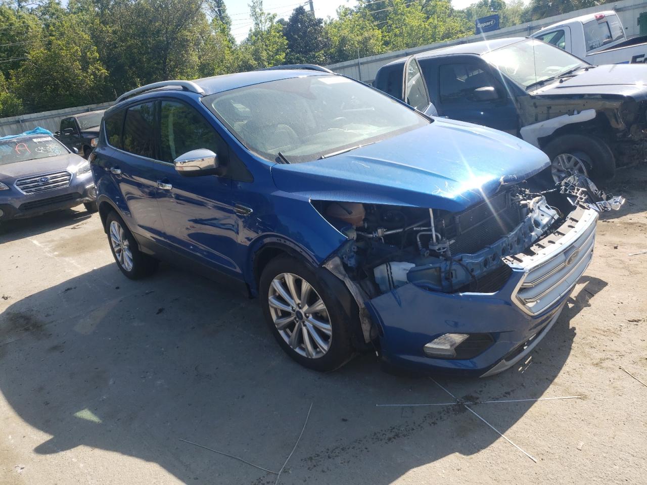 FORD ESCAPE TIT 2017 with VIN 1FMCU0J98HUC86131 - Photo from auction