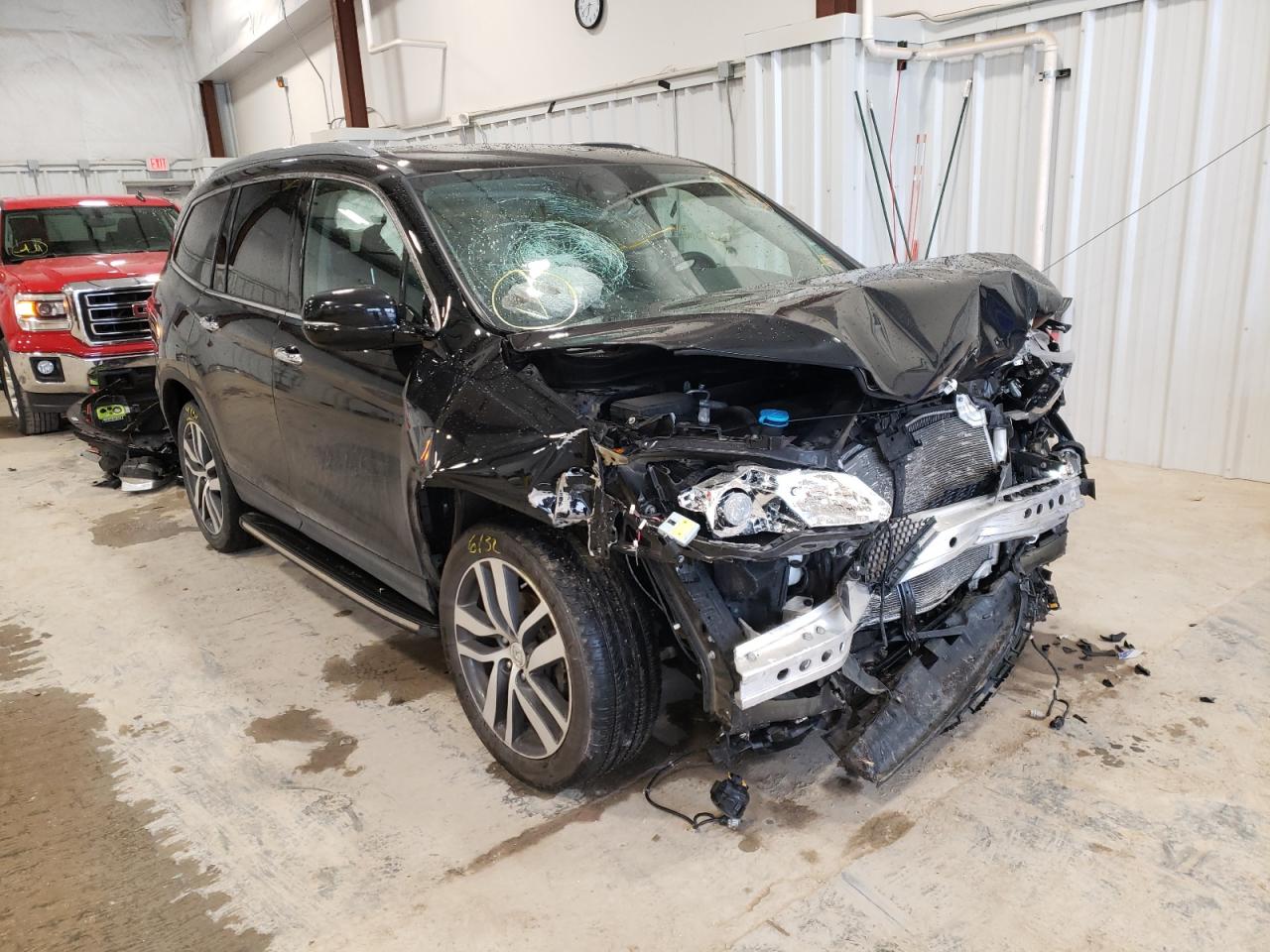 HONDA PILOT ELIT 2016 with VIN 5FNYF6H03GB106835 - Photo from auction