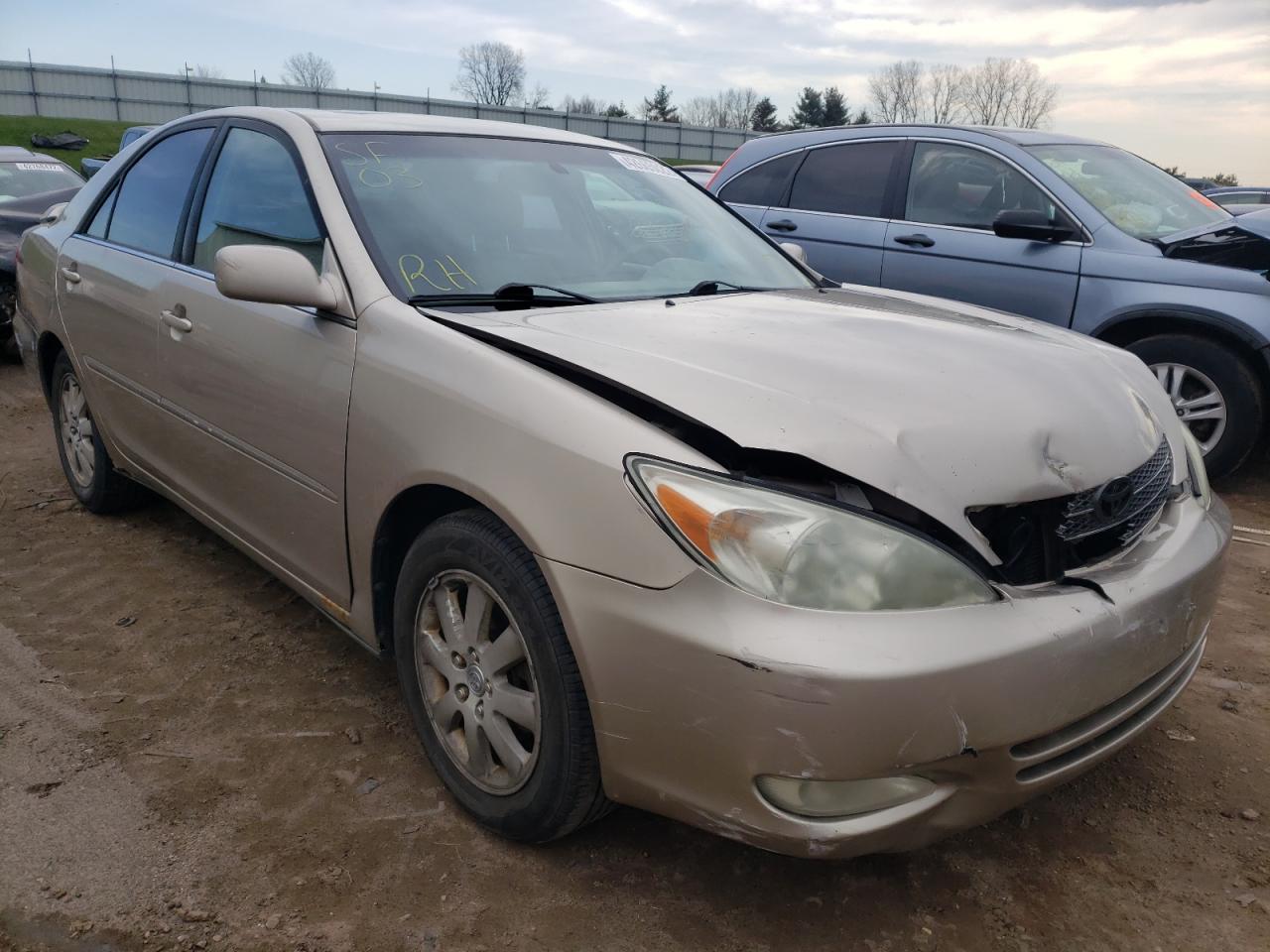 TOYOTA CAMRY LE 2003 with VIN 4T1BE30K83U671017 - Photo from auction