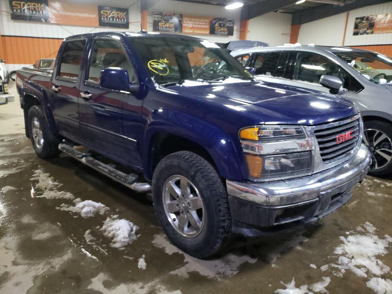 GMC CANYON SLT 2012 with VIN 1GTH6NFE4C8106667 - Photo from auction