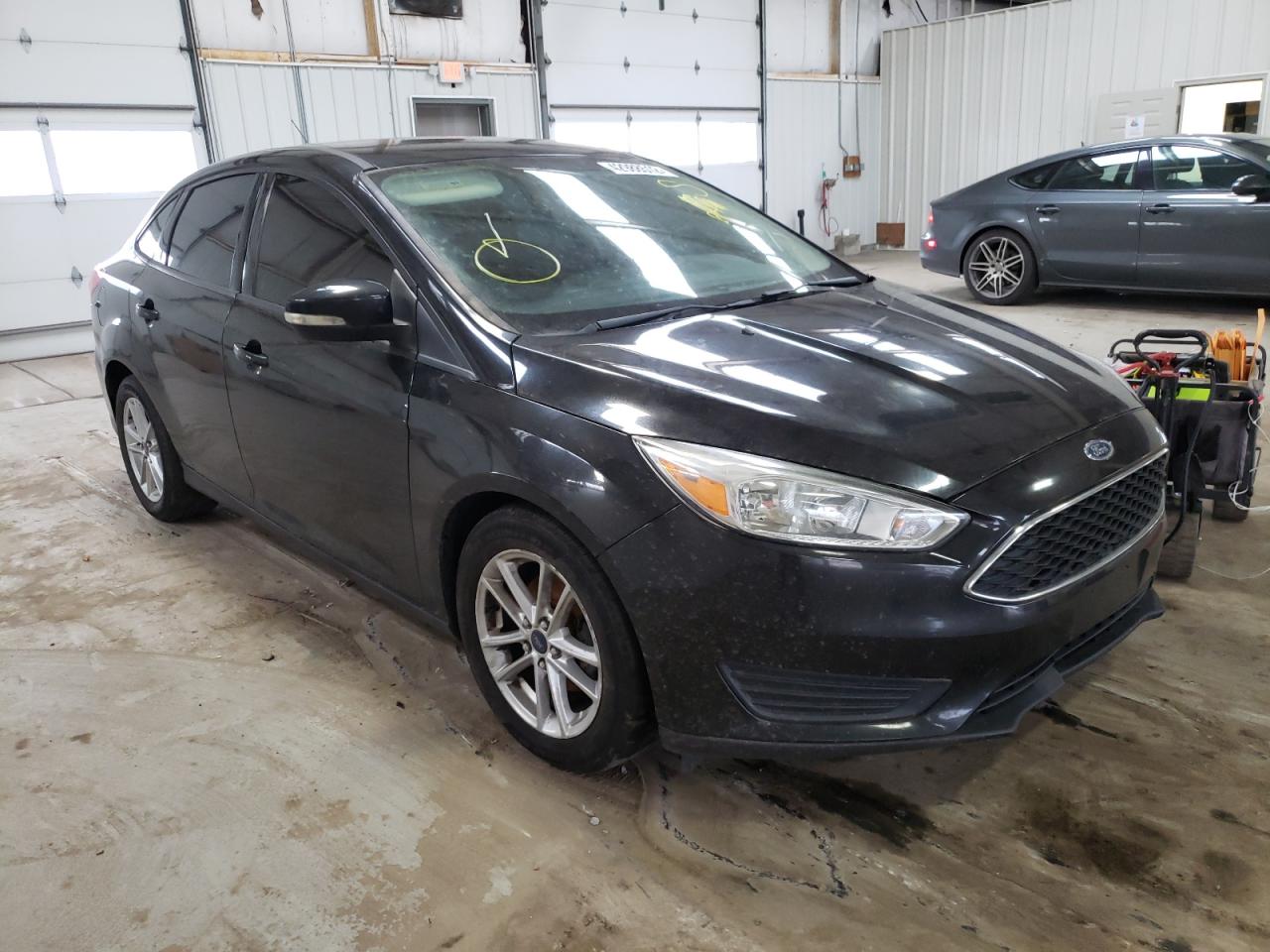FORD FOCUS 2015 with VIN 1FADP3F24FL335122 - Photo from auction
