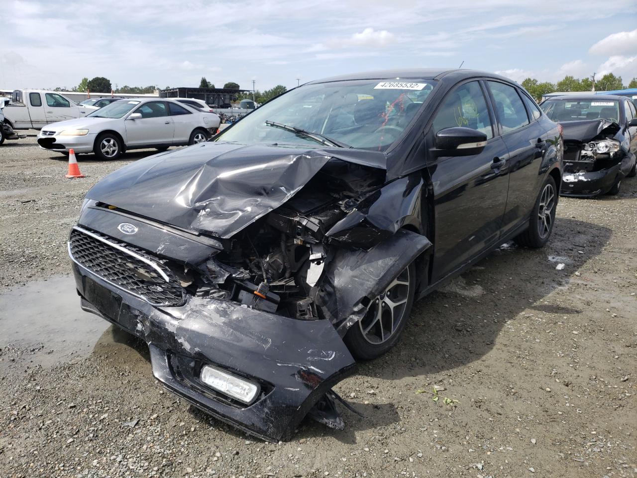 Photo 2 from auction – 2017 FORD FOCUS SE with VIN 1FADP3FE9HL296296