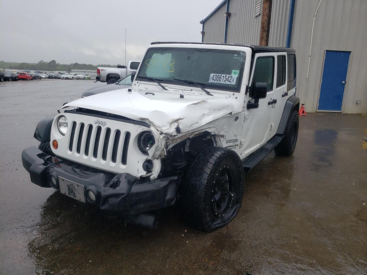 Photo 2 from auction – 2013 JEEP WRANGLER U with VIN 1C4BJWDG1DL599348