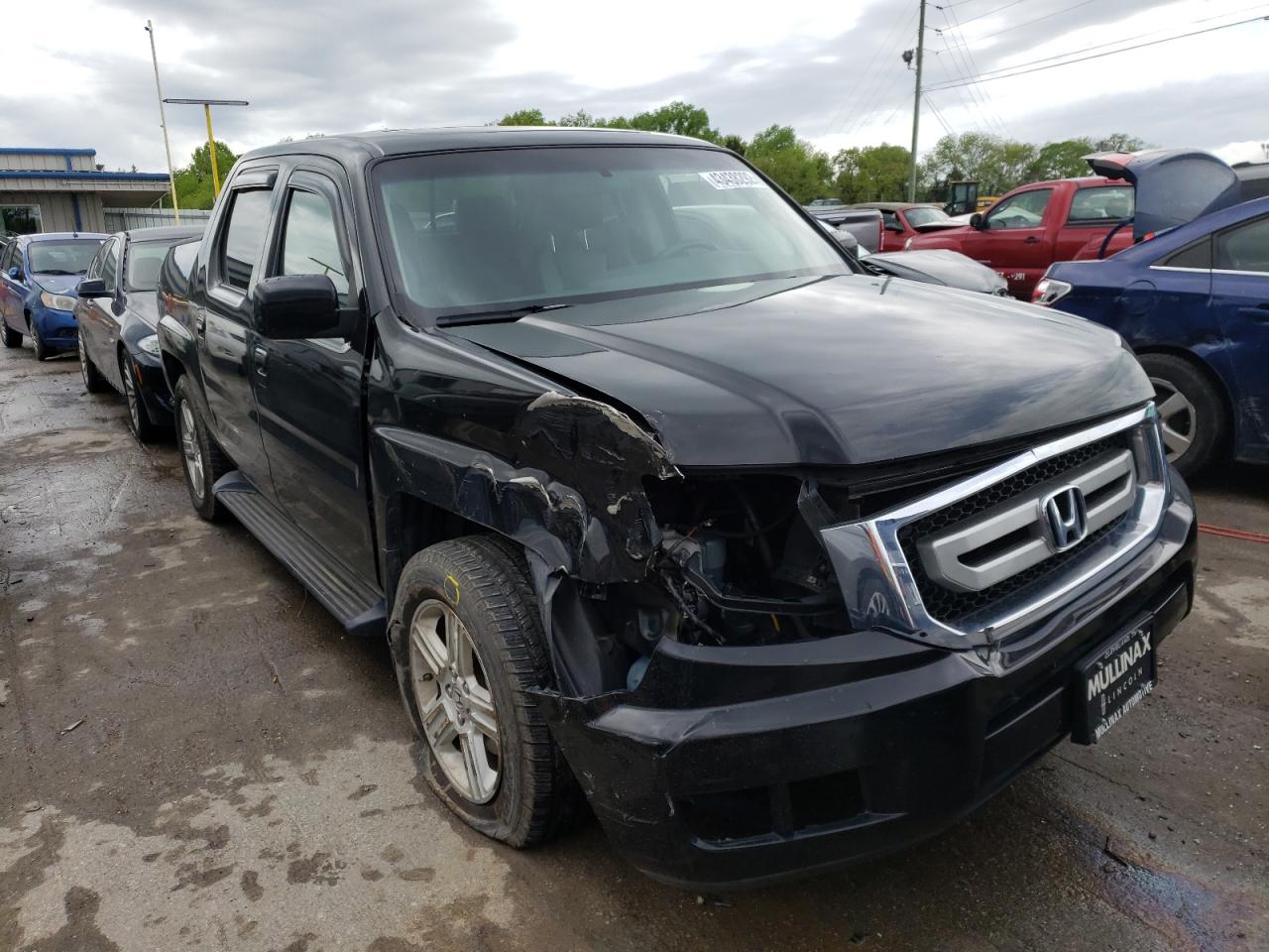 HONDA RIDGELINE 2011 with VIN 5FPYK1F54BB007132 - Photo from auction