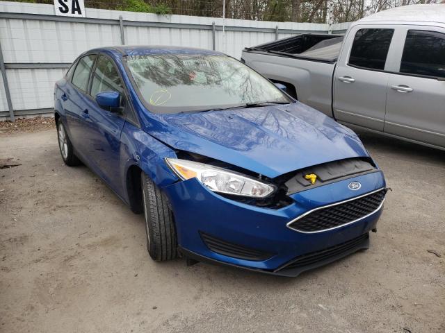 FORD FOCUS SE 2018 with VIN 1FADP3F2XJL214099 - Photo from auction